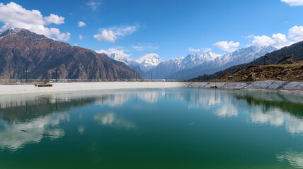Snow-covered mountains and ski slopes in Auli with panoramic Himalayan views